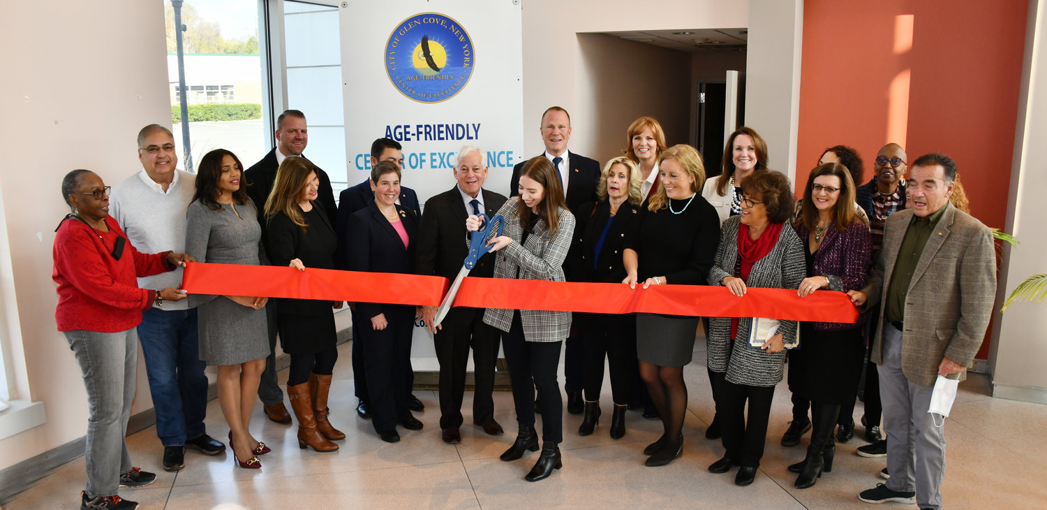 Vincenza Caruso, age-friendly administrator, cut the ribbon to celebrate the new signs that will be placed throughout the city promoting its Age-Friendly status.